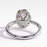 Oval lab-grown diamond halo engagement ring in 18K (750) white gold, on white background 