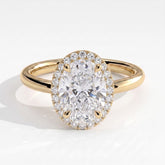 Oval lab-grown diamond halo engagement ring in 18K (750) yellow gold, front view 