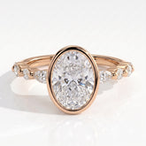 Oval lab-grown diamond bezel-set halo engagement ring in 18K (750) rose gold, front view 