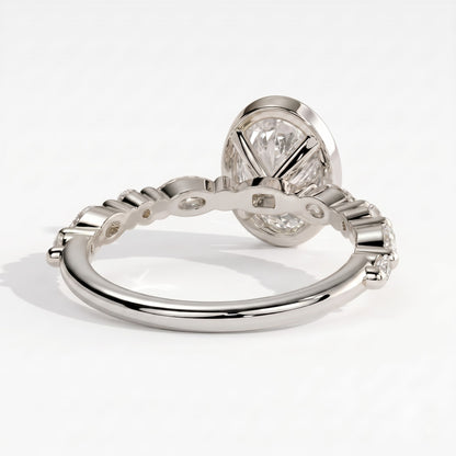 Oval lab-grown diamond bezel-set halo engagement ring in 950 platinum, on white background 