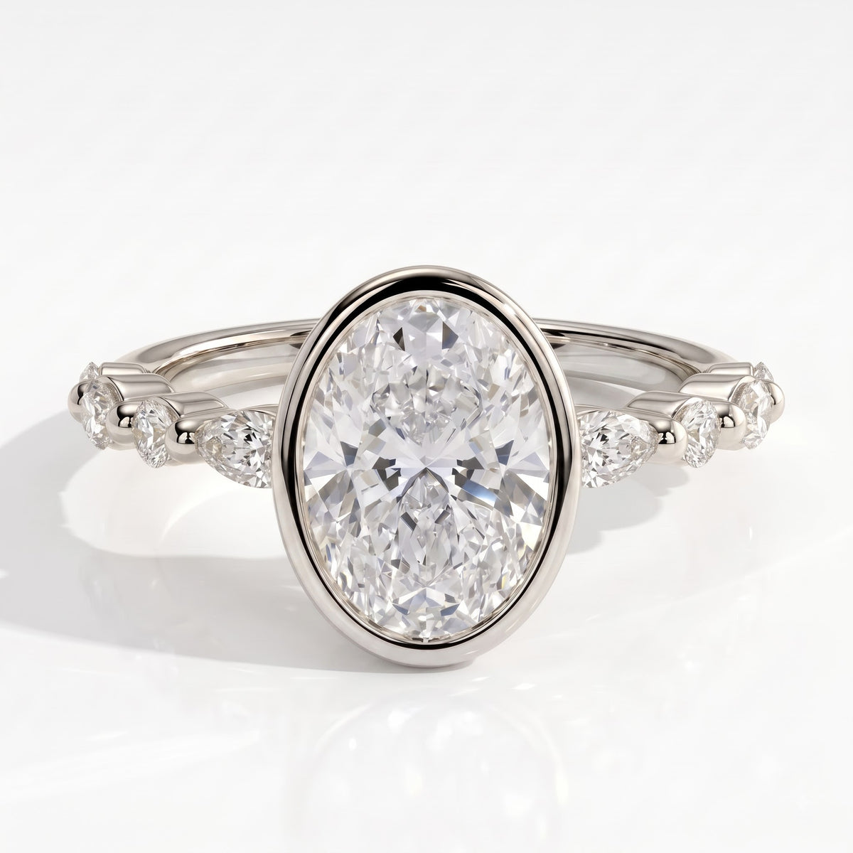 Oval lab-grown diamond bezel-set halo engagement ring in 950 platinum, front view 