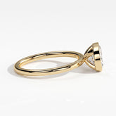 Oval lab-grown diamond bezel-set east-west solitaire engagement ring in 18K (750) yellow gold, detail view 