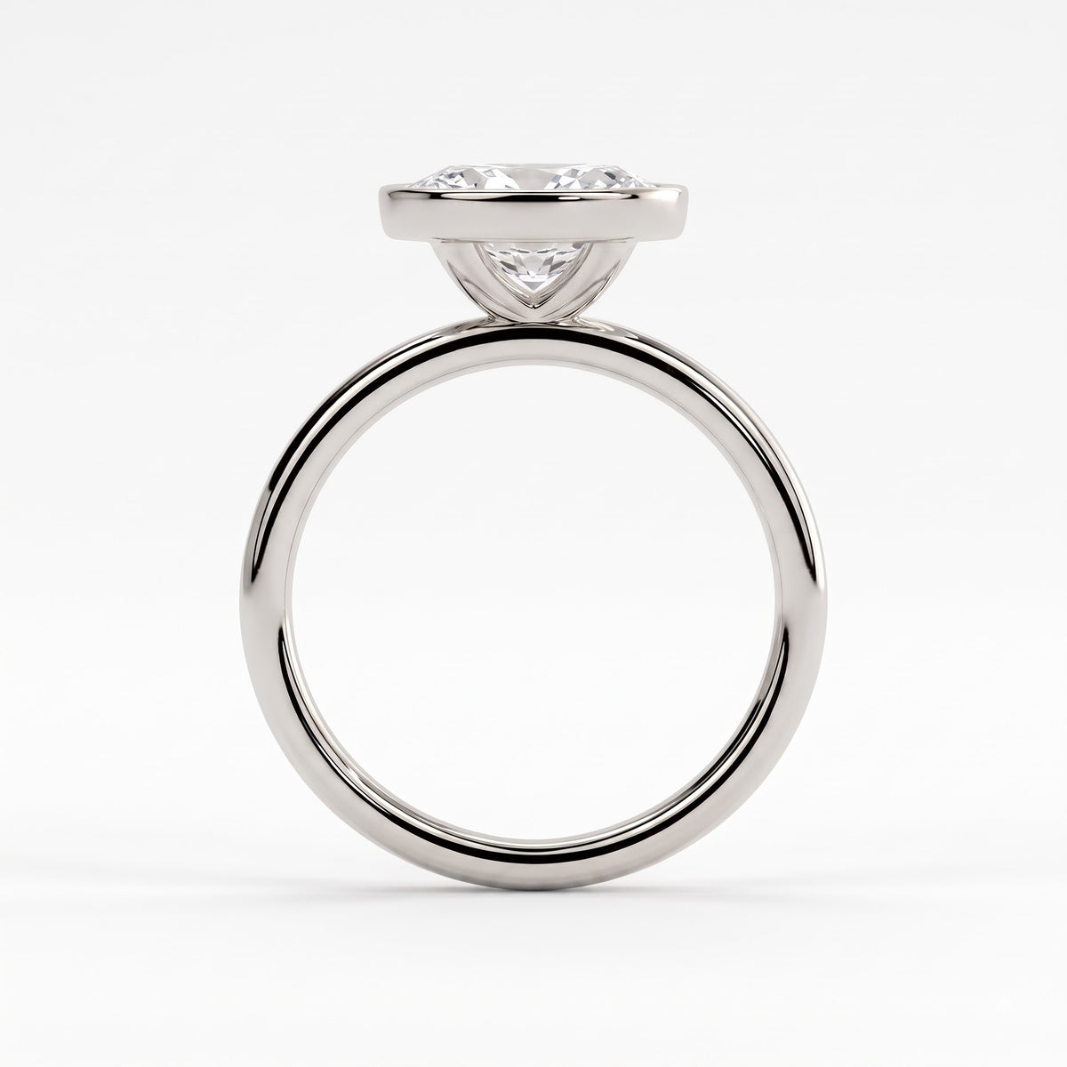 Oval lab-grown diamond bezel-set east-west solitaire engagement ring in 950 platinum, side profile 