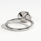 Oval lab-grown diamond bezel-set east-west solitaire engagement ring in 950 platinum, on white background 