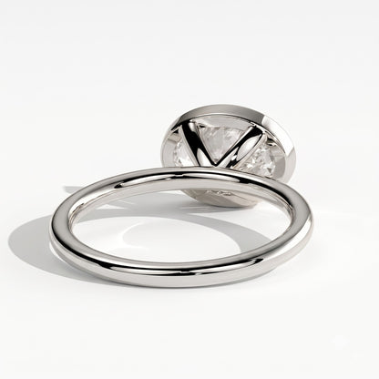 Oval lab-grown diamond bezel-set east-west solitaire engagement ring in 950 platinum, on white background 