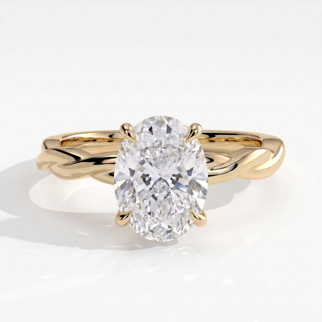 Oval lab-grown diamond solitaire engagement ring in 14K (585) yellow gold, front view 