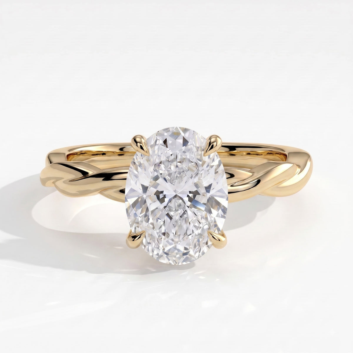Oval lab-grown diamond solitaire engagement ring in 14K (585) yellow gold, front view 