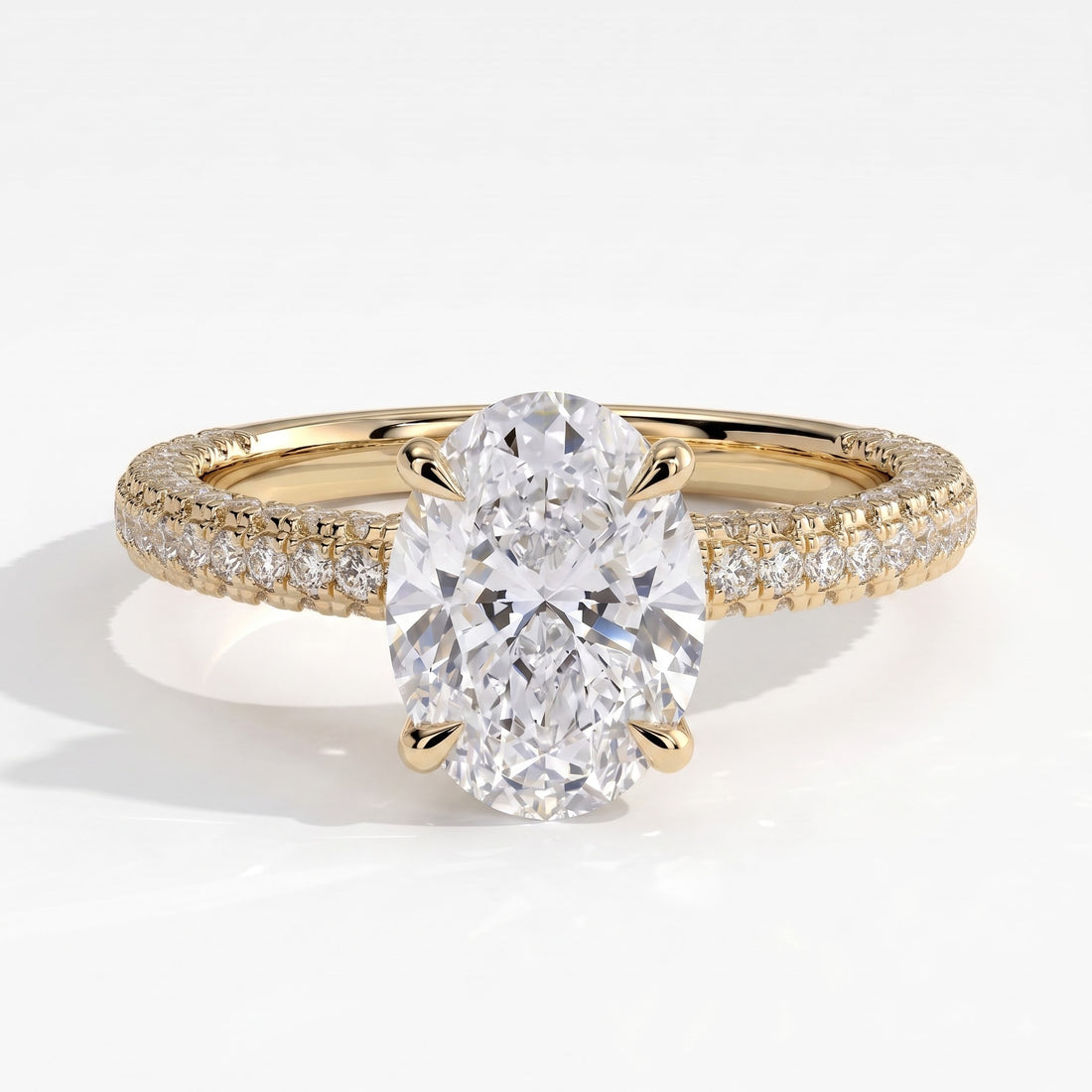 Oval lab-grown diamond halo engagement ring in 14K (585) yellow gold, front view 