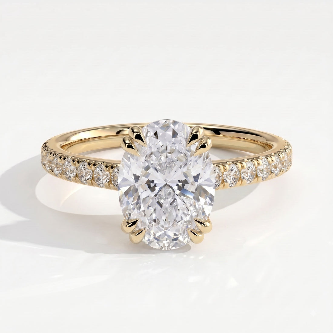 Oval lab-grown diamond halo engagement ring in 14K (585) yellow gold, front view 