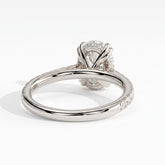 Oval lab-grown diamond halo engagement ring in 18K (750) white gold, on white background 