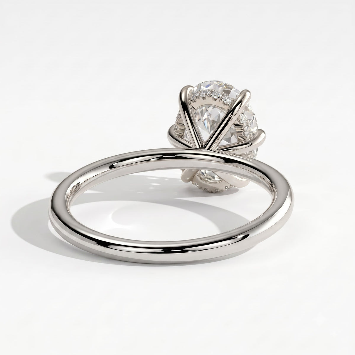 Oval lab-grown diamond solitaire engagement ring in 14K (585) white gold, on white background 
