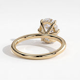 Oval lab-grown diamond solitaire engagement ring in 14K (585) yellow gold, on white background 