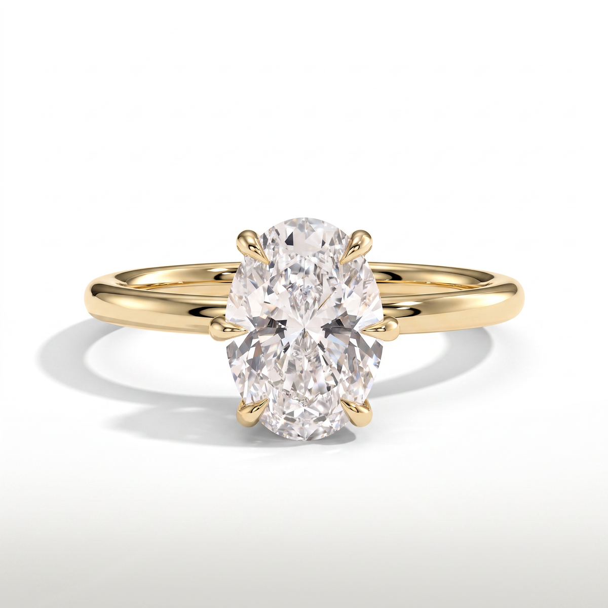 Oval lab-grown diamond solitaire engagement ring in 14K (585) yellow gold, front view 