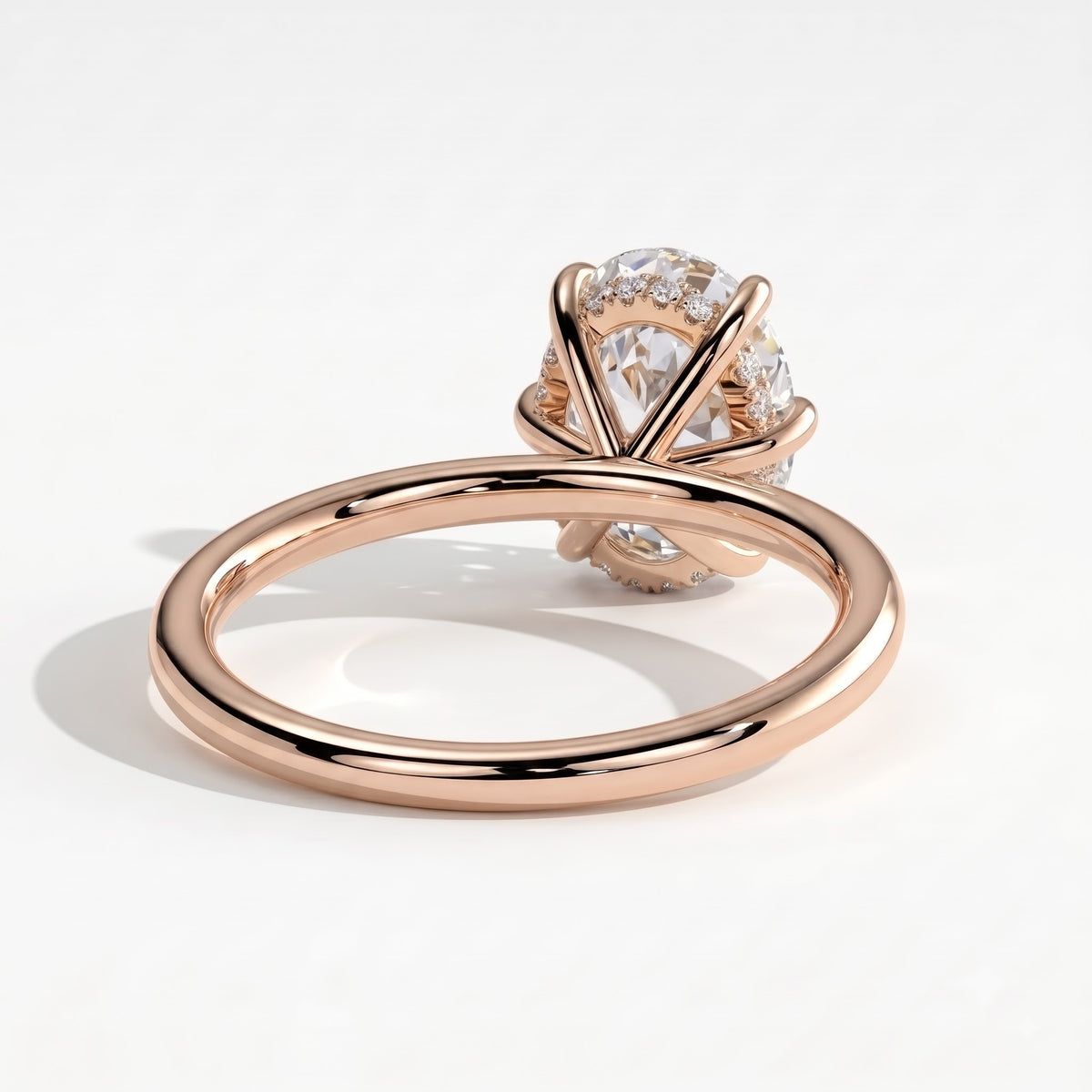 Oval lab-grown diamond solitaire engagement ring in 14K (585) rose gold, on white background 