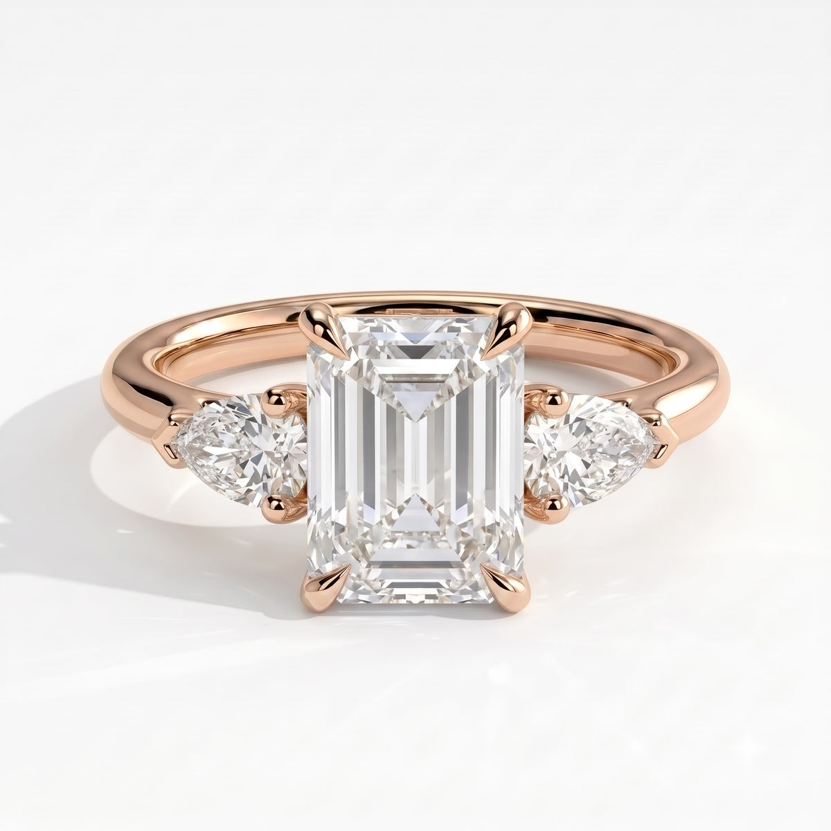 Emerald lab-grown diamond three-stone engagement ring in 14K (585) rose gold, front view 