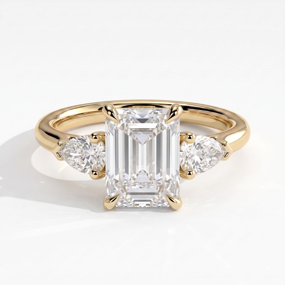 Emerald lab-grown diamond three-stone engagement ring in 14K (585) yellow gold, front view 