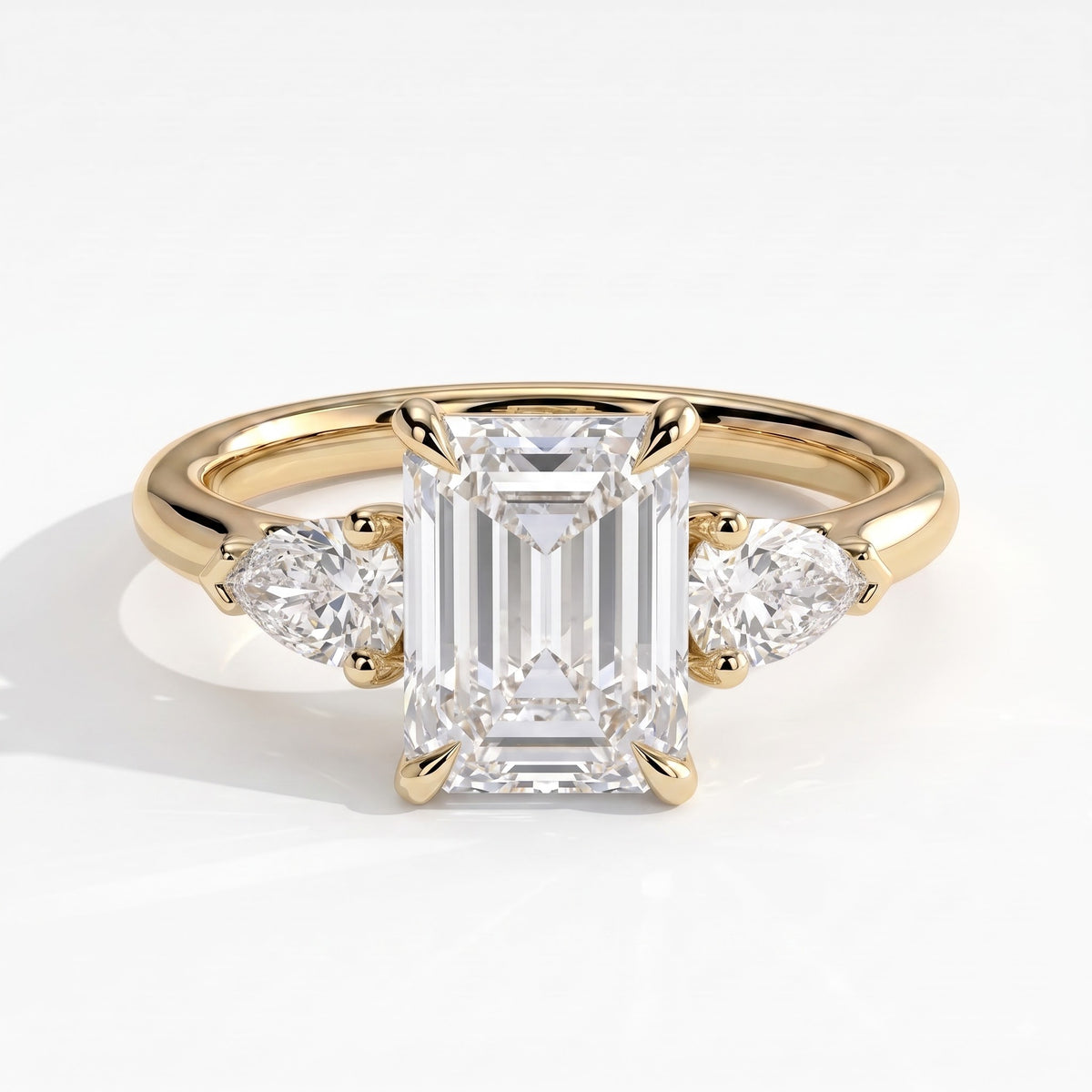 Emerald lab-grown diamond three-stone engagement ring in 14K (585) yellow gold, front view 