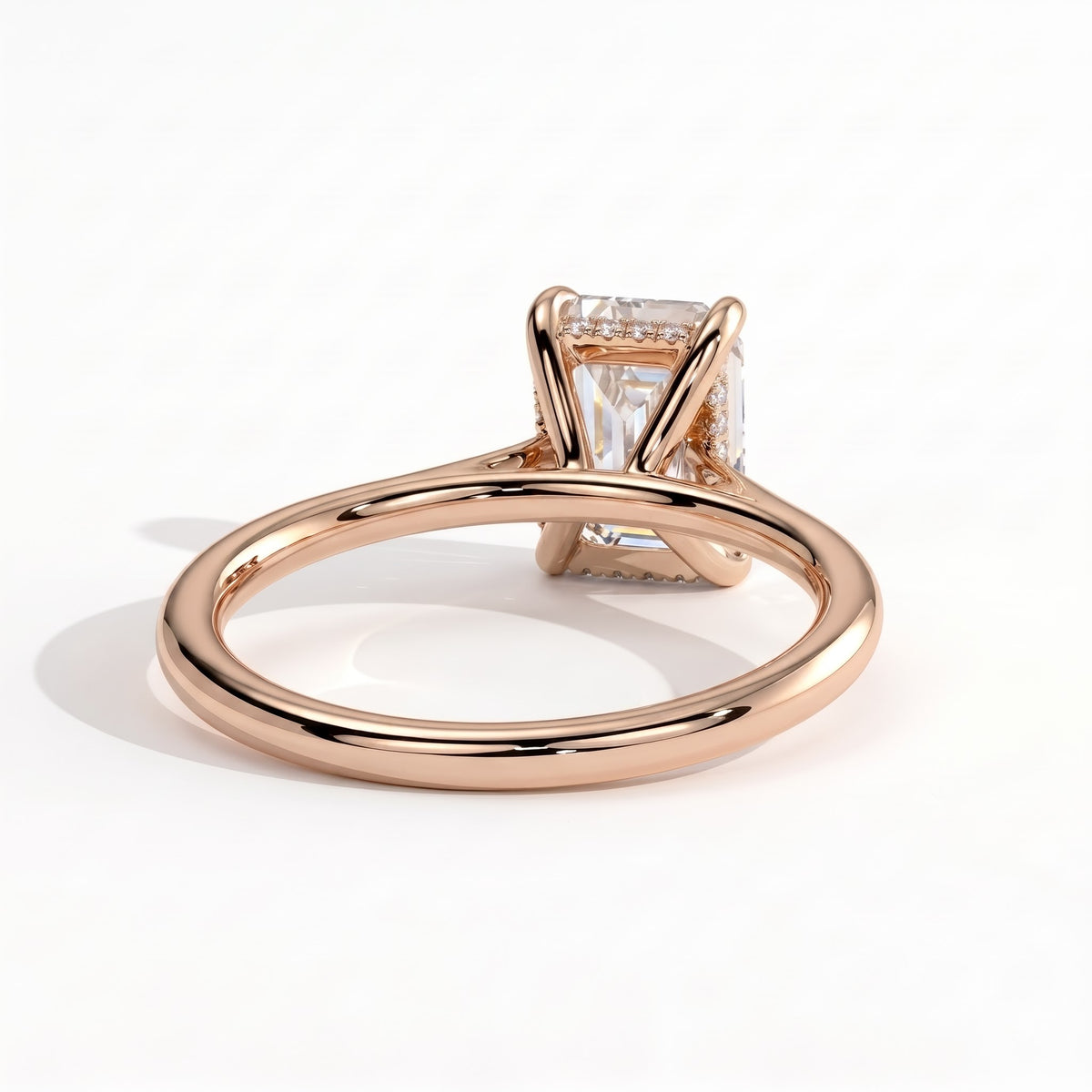 Radiant lab-grown diamond halo engagement ring in 18K (750) rose gold, on white background 