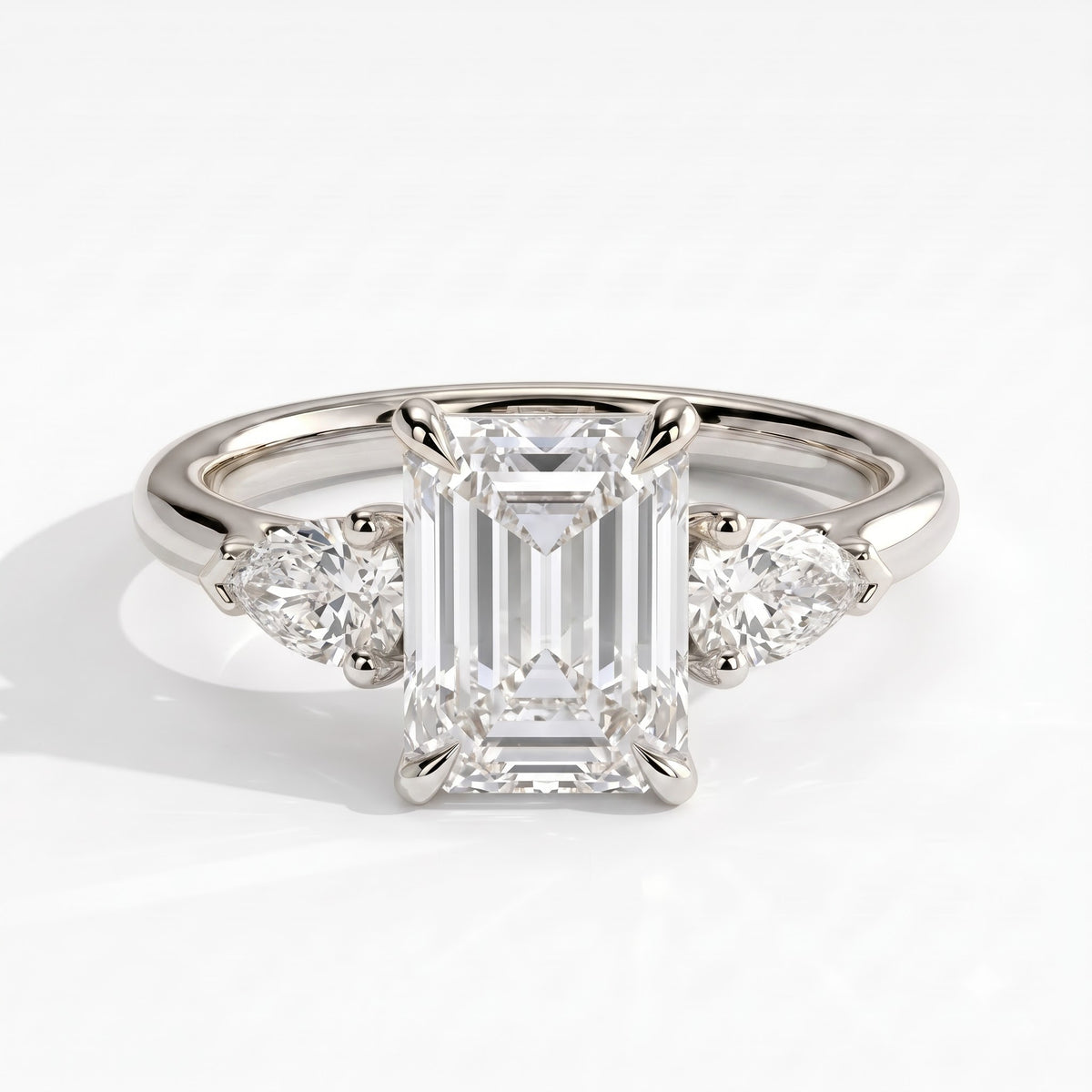 Emerald lab-grown diamond three-stone engagement ring in 950 platinum, front view 