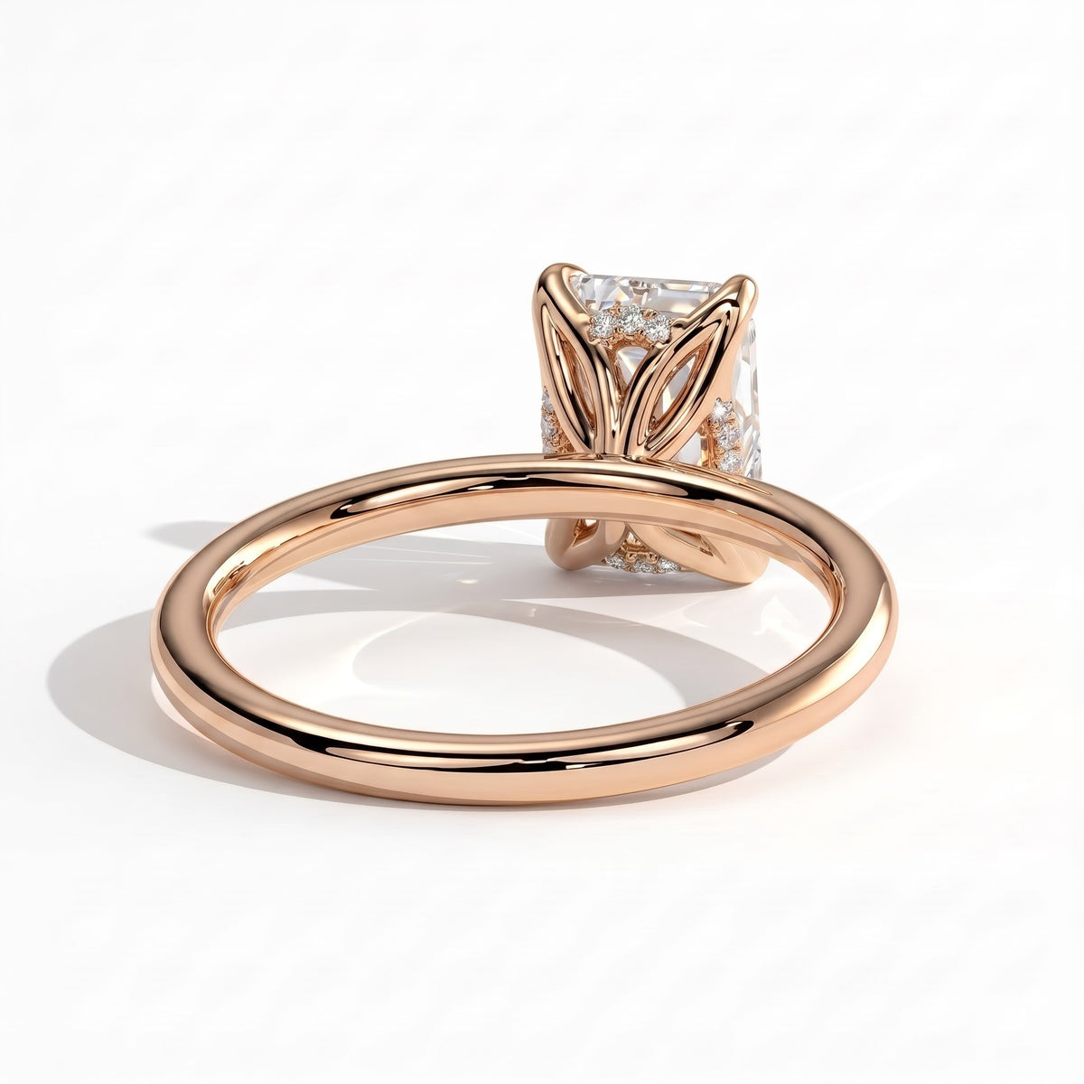 Emerald lab-grown diamond solitaire engagement ring in 14K (585) rose gold, on white background 