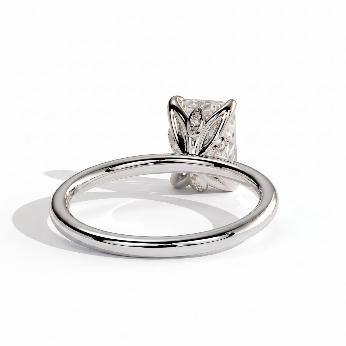 Emerald lab-grown diamond solitaire engagement ring in 18K (750) white gold, on white background 