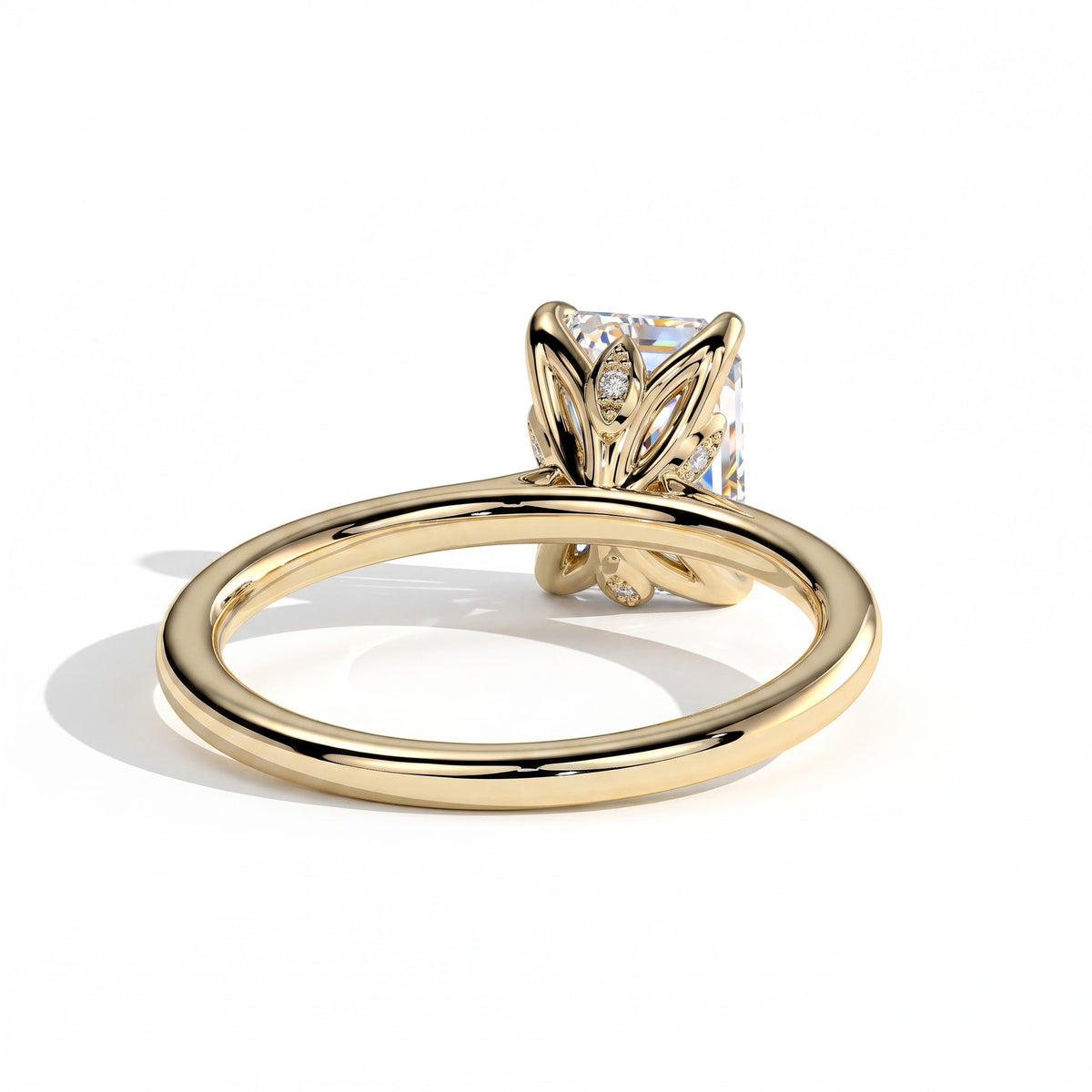 Emerald lab-grown diamond halo engagement ring in 14K (585) yellow gold, on white background 