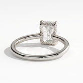 Emerald lab-grown diamond solitaire engagement ring in 18K (750) white gold, on white background 