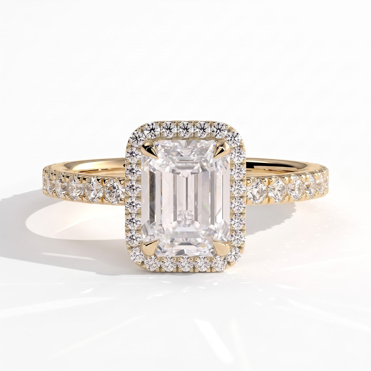 Emerald lab-grown diamond halo engagement ring in 18K (750) yellow gold, front view 