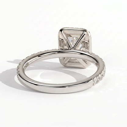 Emerald lab-grown diamond halo engagement ring in 950 platinum, on white background 