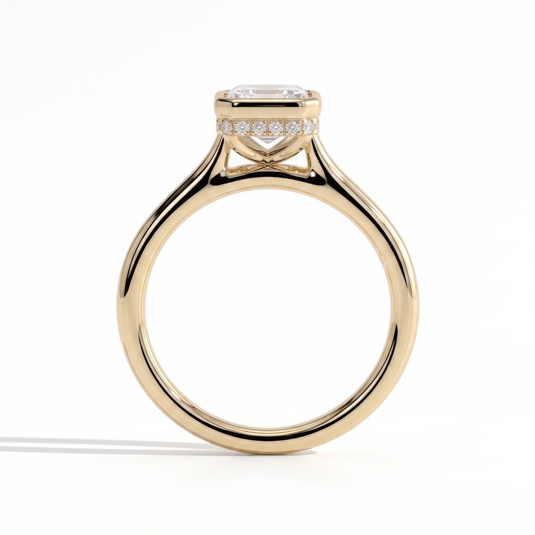 Emerald lab-grown diamond bezel-set halo engagement ring in 14K (585) yellow gold, side profile 