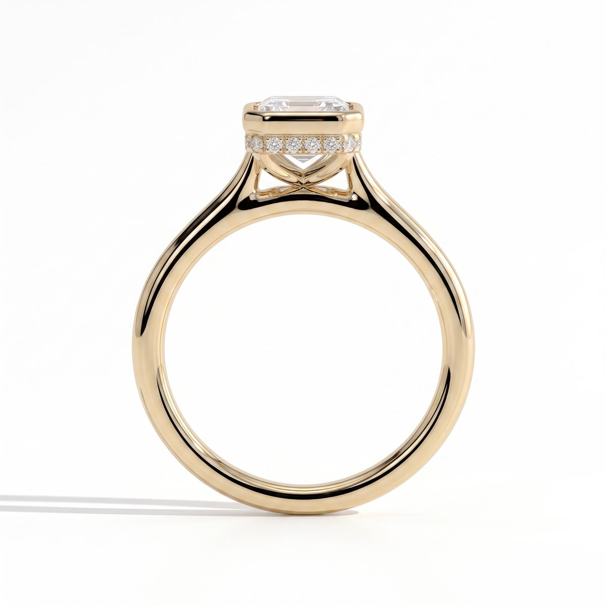Emerald lab-grown diamond bezel-set halo engagement ring in 14K (585) yellow gold, side profile 