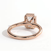Emerald lab-grown diamond bezel-set halo engagement ring in 14K (585) rose gold, on white background 