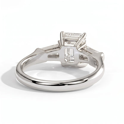 Emerald lab-grown diamond three-stone engagement ring in 14K (585) white gold, on white background 