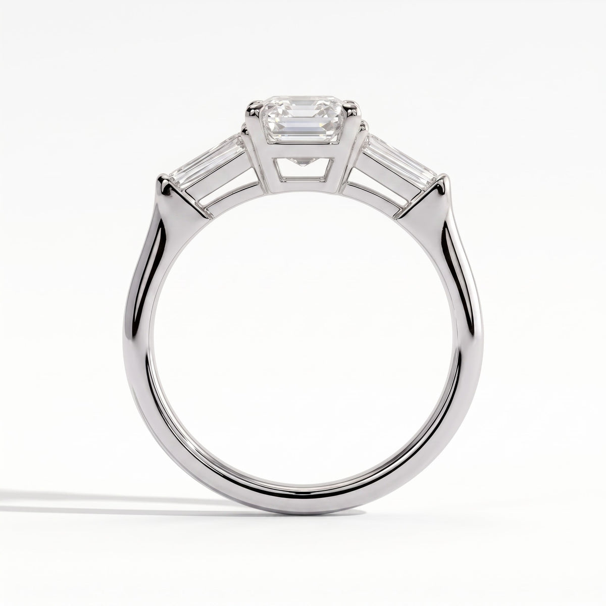 Emerald lab-grown diamond three-stone engagement ring in 14K (585) white gold, side profile 
