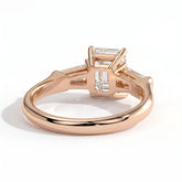 Emerald lab-grown diamond three-stone engagement ring in 14K (585) rose gold, on white background 