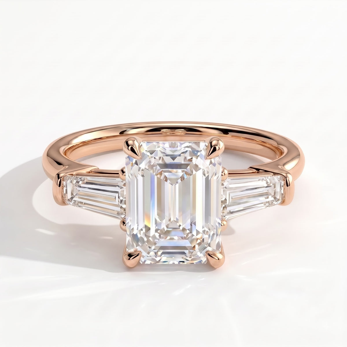 Emerald lab-grown diamond three-stone engagement ring in 14K (585) rose gold, front view 