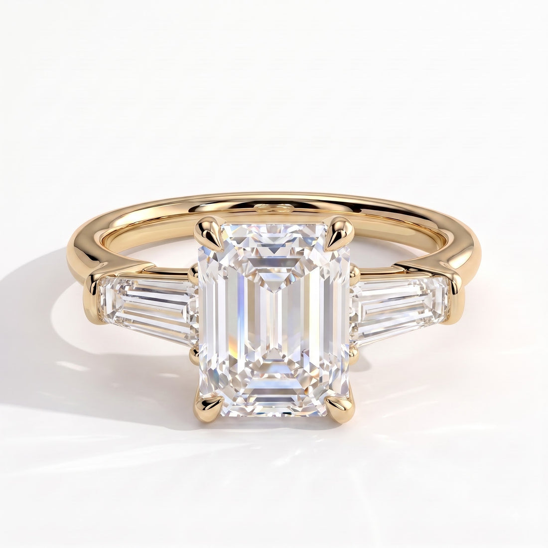 Emerald lab-grown diamond three-stone engagement ring in 14K (585) yellow gold, front view 