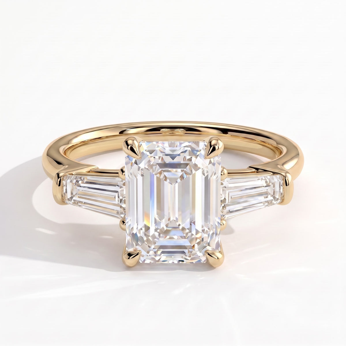 Emerald lab-grown diamond three-stone engagement ring in 14K (585) yellow gold, front view 