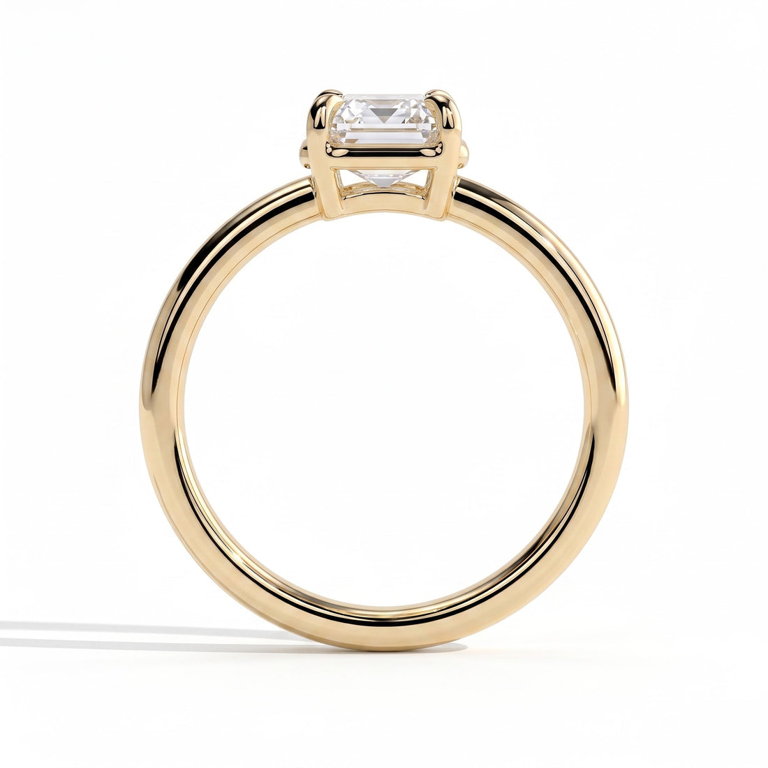 Emerald lab-grown diamond bezel-set solitaire engagement ring in 14K (585) yellow gold, side profile 