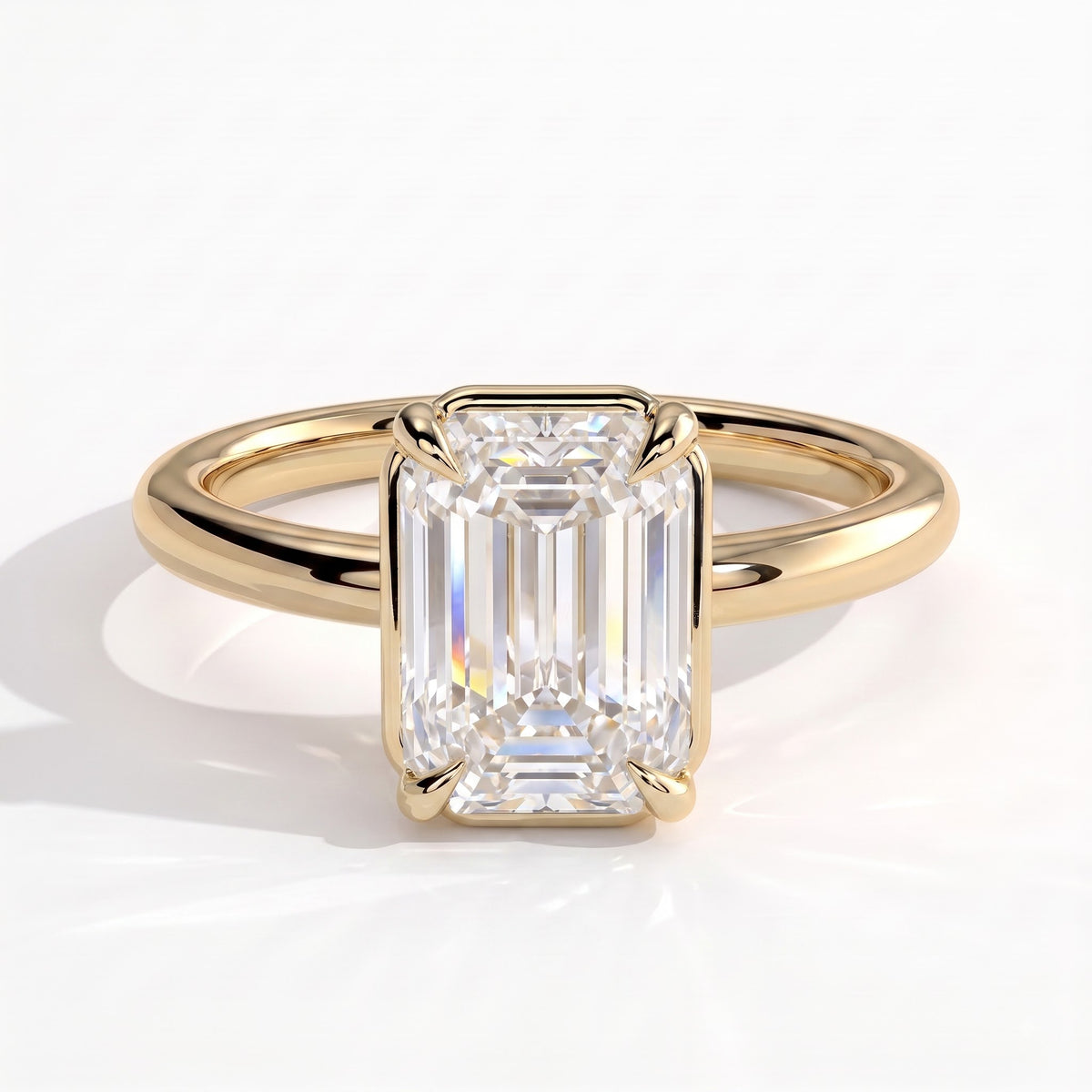 Emerald lab-grown diamond bezel-set solitaire engagement ring in 14K (585) yellow gold, front view 