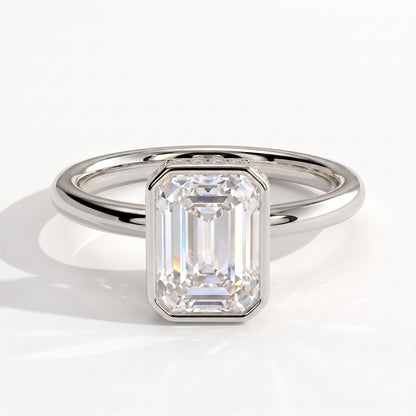 Emerald lab-grown diamond bezel-set halo engagement ring in 18K (750) white gold, front view 