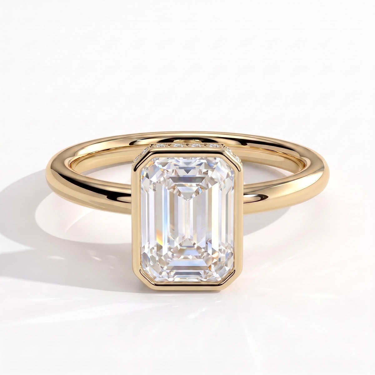 Emerald lab-grown diamond bezel-set halo engagement ring in 18K (750) yellow gold, front view 