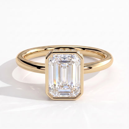 Emerald lab-grown diamond bezel-set halo engagement ring in 18K (750) yellow gold, front view 