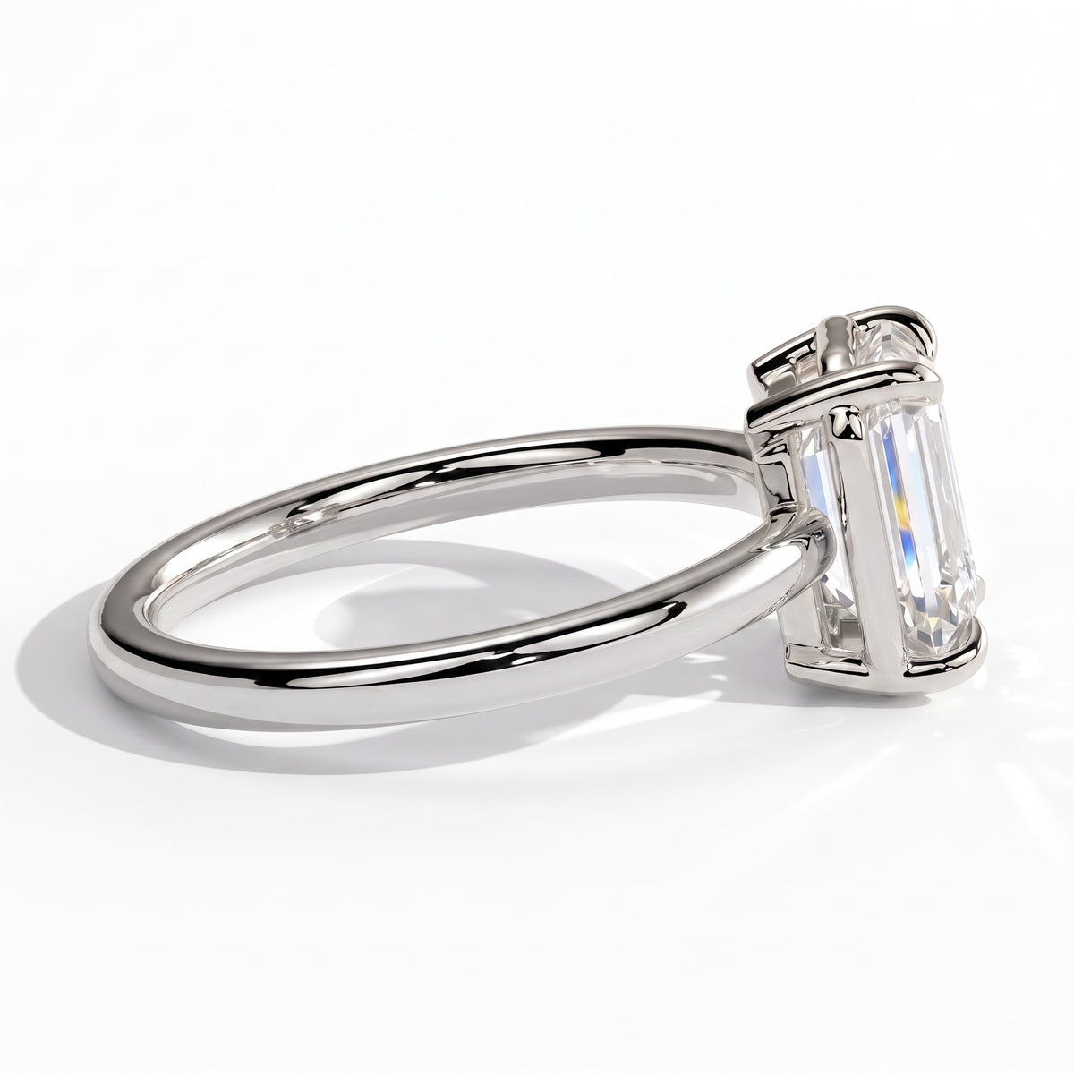 Emerald lab-grown diamond bezel-set solitaire engagement ring in 18K (750) white gold, detail view 