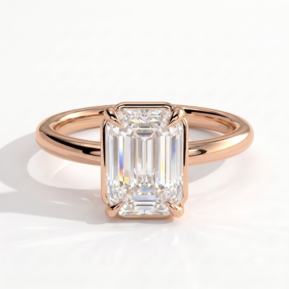 Emerald lab-grown diamond bezel-set solitaire engagement ring in 18K (750) rose gold, front view 