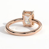 Emerald lab-grown diamond bezel-set solitaire engagement ring in 18K (750) rose gold, on white background 