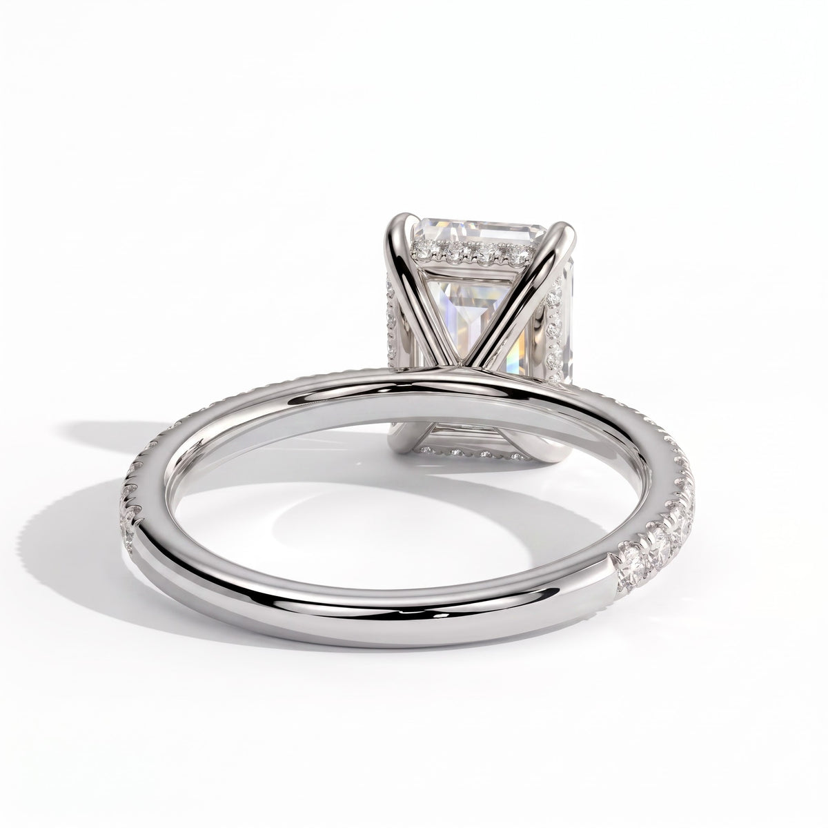 Emerald lab-grown diamond halo engagement ring in 14K (585) white gold, on white background 
