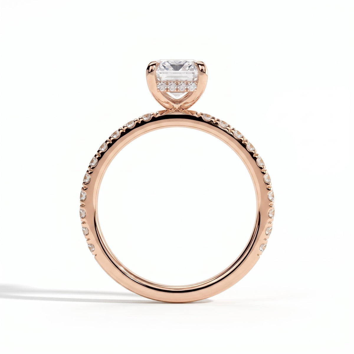 Emerald lab-grown diamond halo engagement ring in 14K (585) rose gold, side profile 