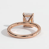 Emerald lab-grown diamond halo engagement ring in 14K (585) rose gold, on white background 