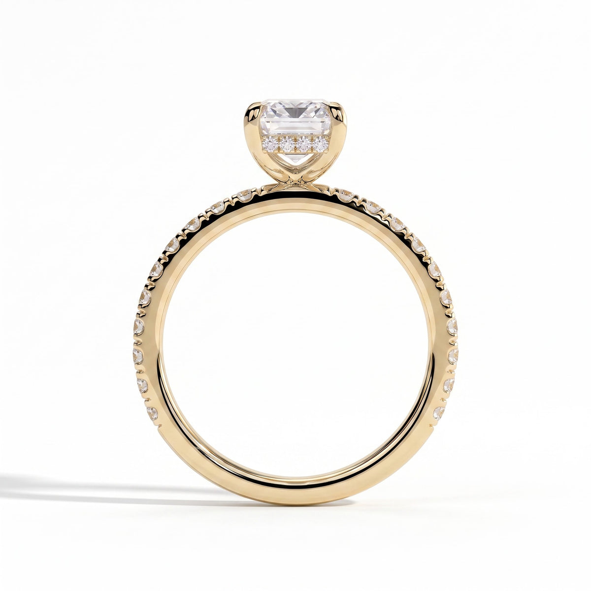 Emerald lab-grown diamond halo engagement ring in 18K (750) yellow gold, side profile 